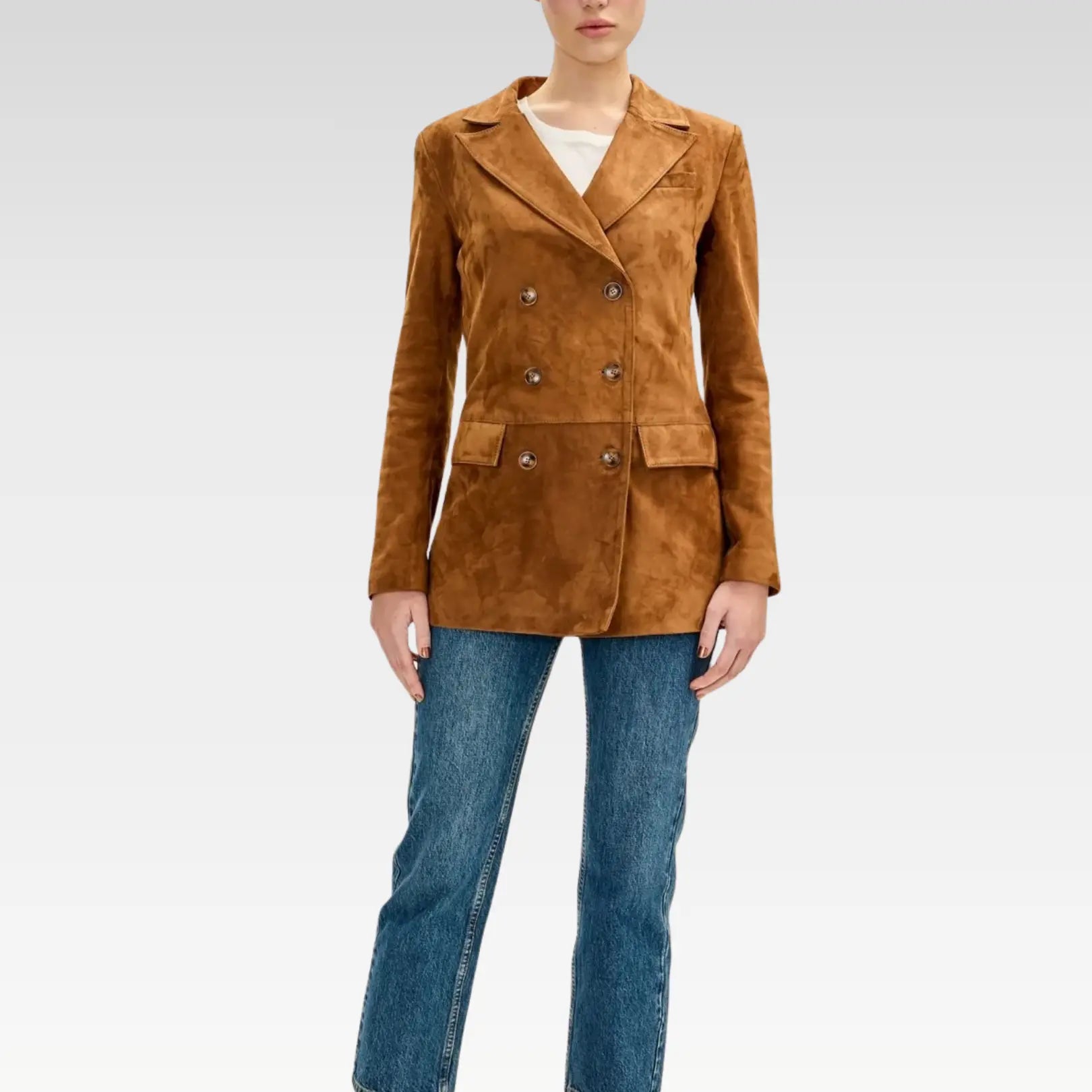 Full front view of brown lambskin suede double-breasted jacket styled with jeans, highlighting tailored silhouette and six-button closure