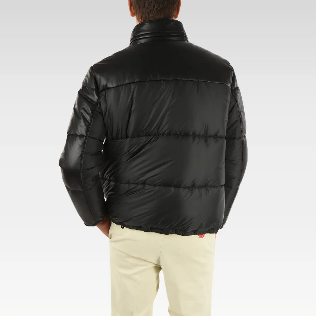 Back view of Drexia Warm Quilted Back Leather Puffer Jacket in black genuine leather, showcasing quilted detailing and relaxed fit.