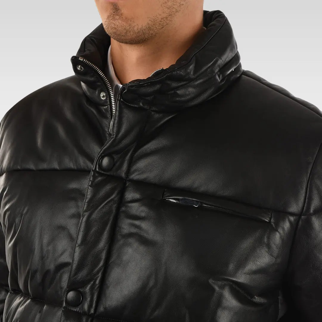 Clos up view of Drexia Warm Quilted Back Leather Puffer Jacket in black, showing structured shoulders and modern quilted design.