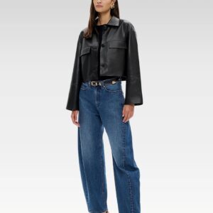  Model wearing cropped leather-look button jacket with flap pockets and relaxed drop shoulders, front view