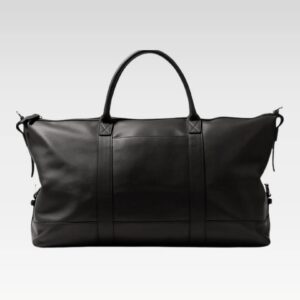 Top view of the Iron Rose Medium Duffle highlighting the smooth full-grain leather exterior, reinforced handles, adjustable side tabs, and secure zipper closure ideal for airline carry-on use.