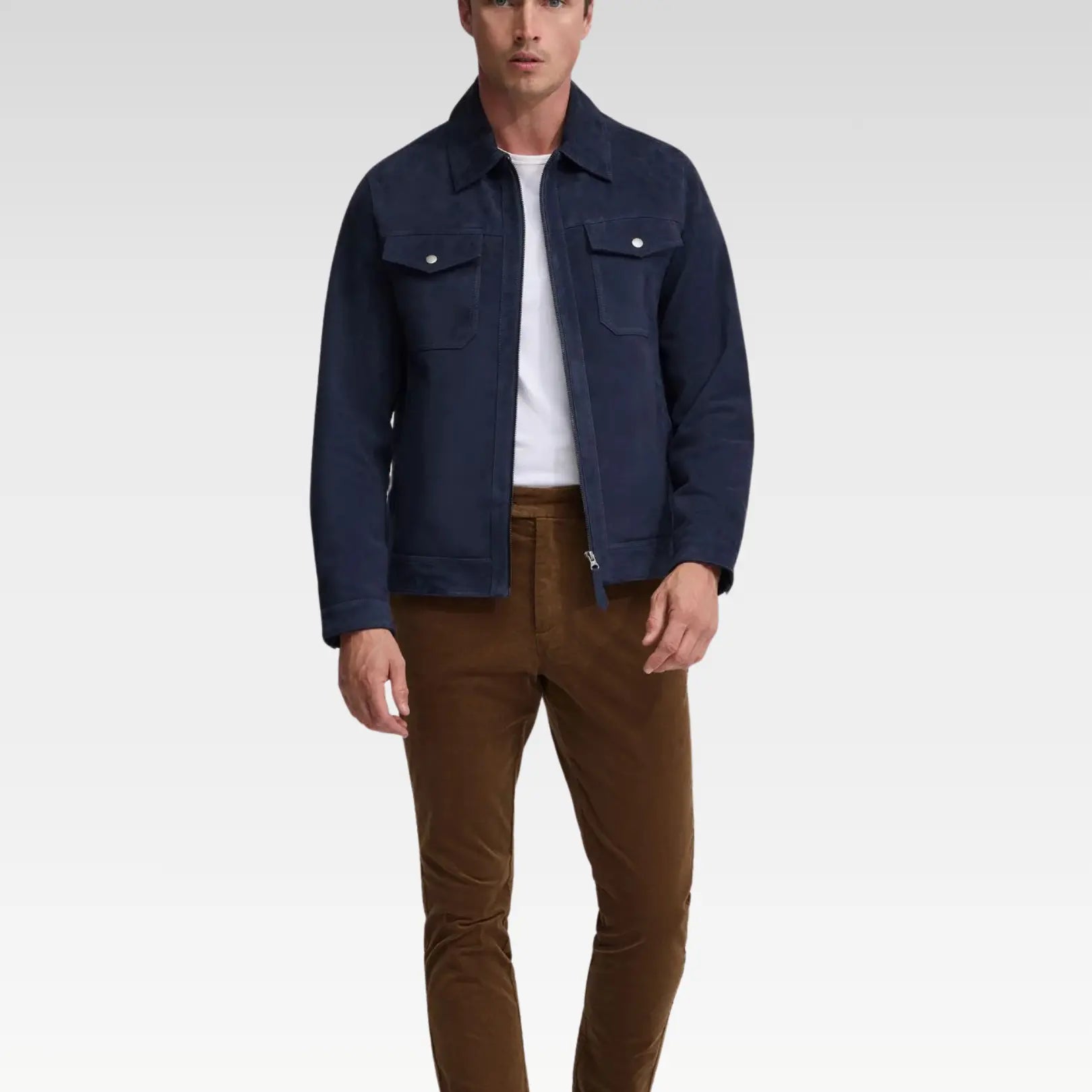 Front view of a navy blue trucker suede jacket with a sleek zip closure, genuine leather suede finish, regular fit, and chest pockets for a timeless, versatile style