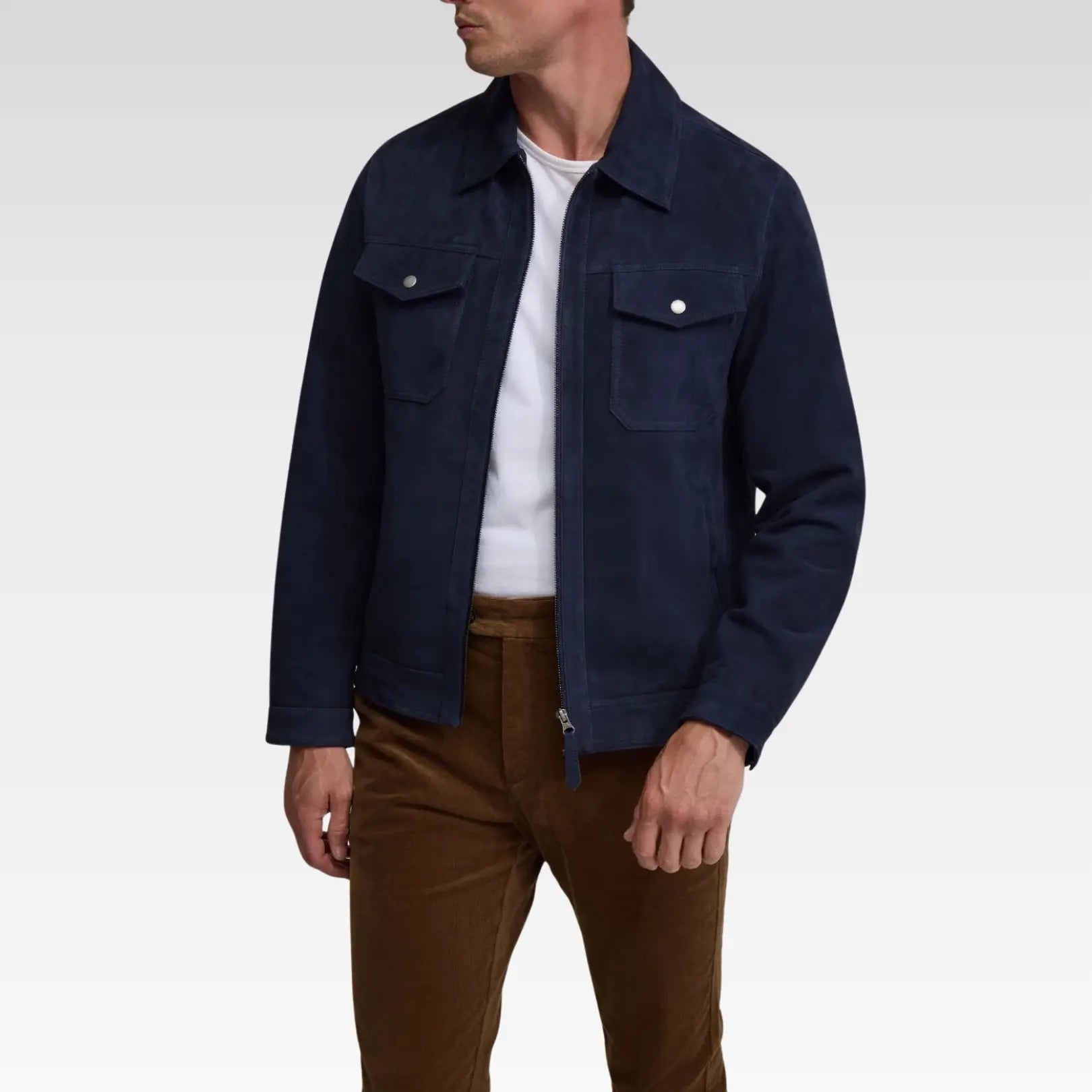Side view of a navy blue trucker suede jacket showcasing sleeve buttons, genuine leather suede finish, regular fit, and side pockets for practical, all-season wear