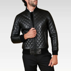 Model posing in the Paul black diamond-quilted leather bomber jacket with hand on chest, highlighting luxurious lambskin leather and tailored fit.
