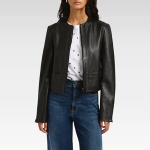 Woman styling Rebecca black collarless biker jacket with jeans in relaxed pose, highlighting the jacket's contemporary silhouette and everyday wearability