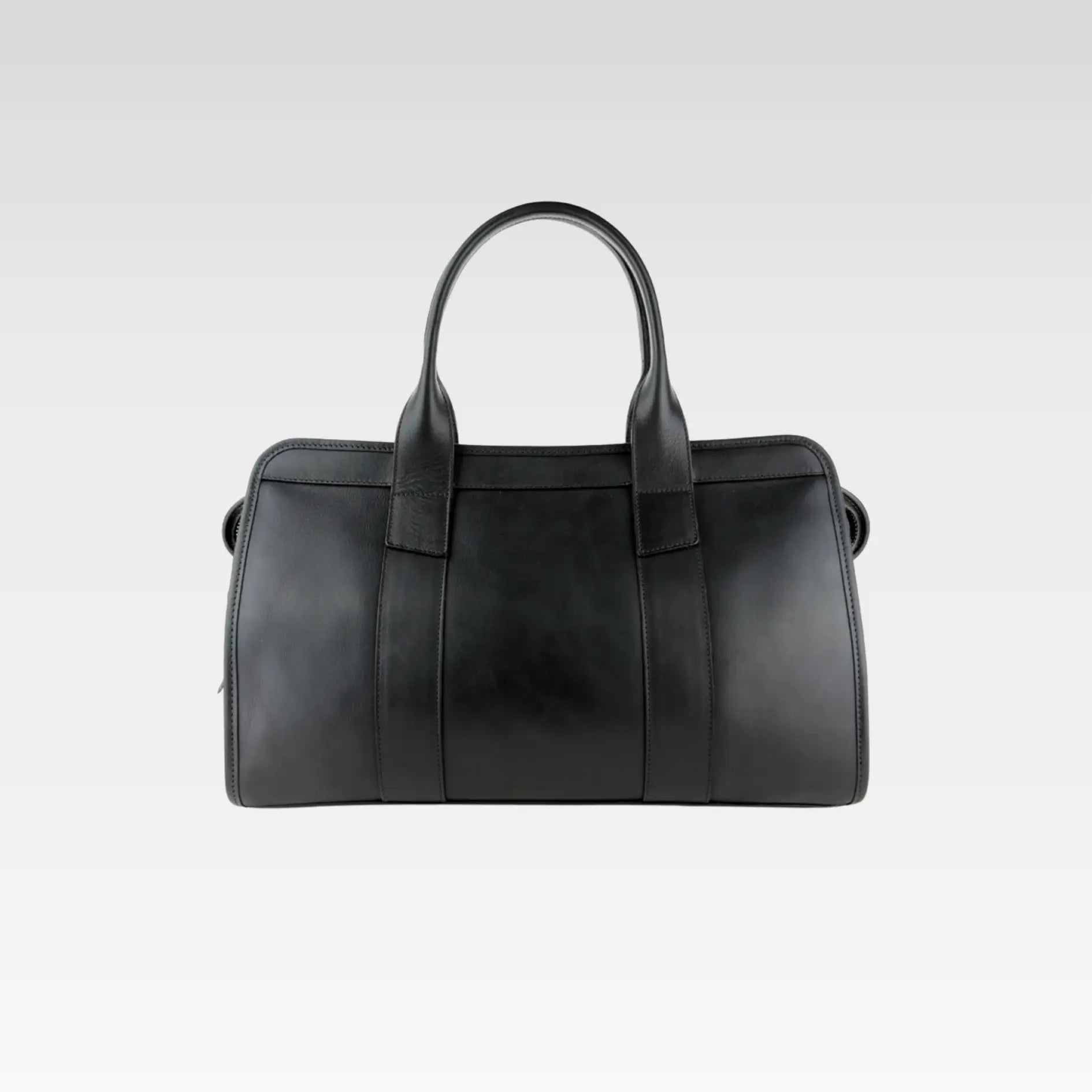 Front view of the Signature Weekender Leather Duffle in black showcasing rolled handles and solid brass hardware, ideal for stylish travel.