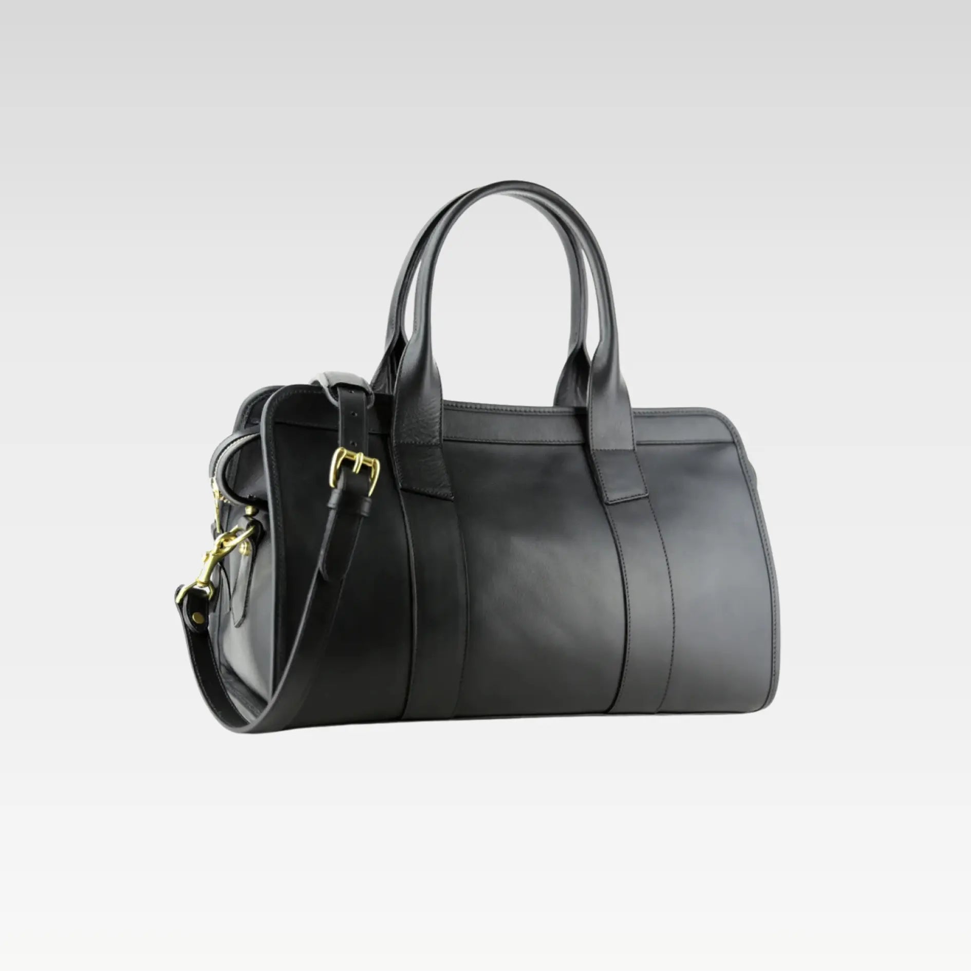 Side angle of the black Signature Weekender Leather Duffle highlighting smooth leather craftsmanship, durable construction, and solid brass zipper