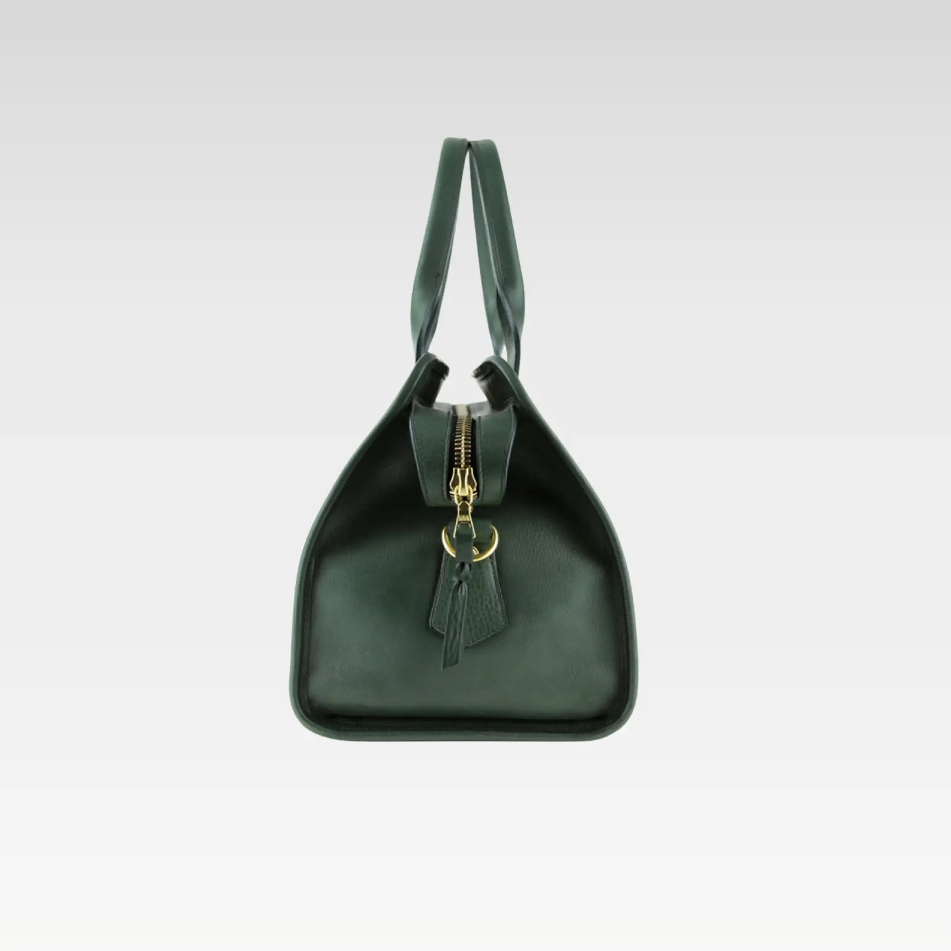 Side angle of the Green Signature Weekender Leather Duffle highlighting smooth leather craftsmanship, durable construction, and solid brass zipper.