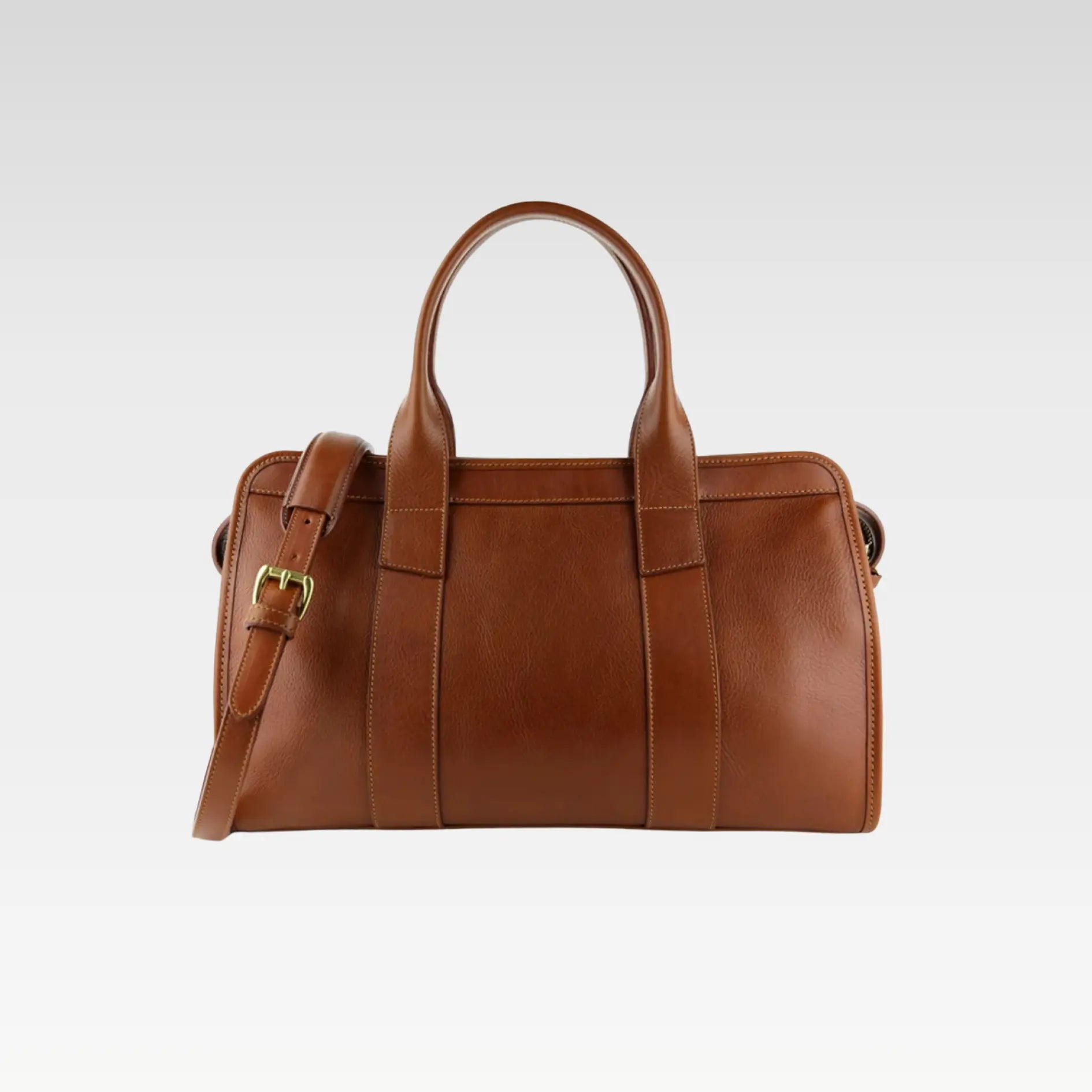 Front view of the Signature Weekender Leather Duffle in brown, showcasing rolled handles and solid brass hardware, ideal for stylish travel.