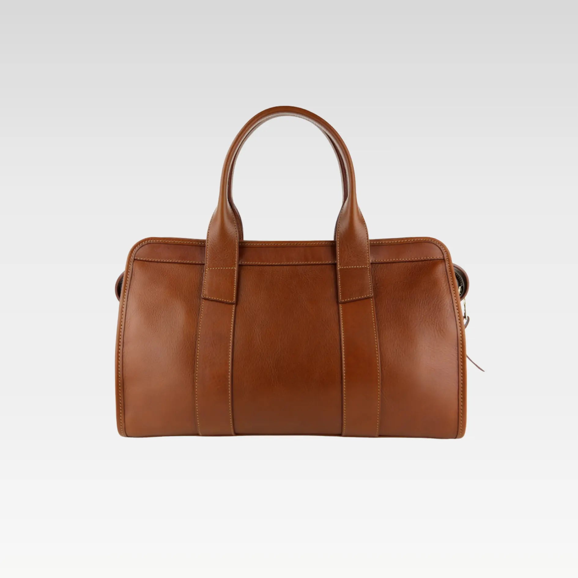 Full side profile of the brown Signature Weekender Leather Duffle highlighting compact size, elegant design, and practical travel features.