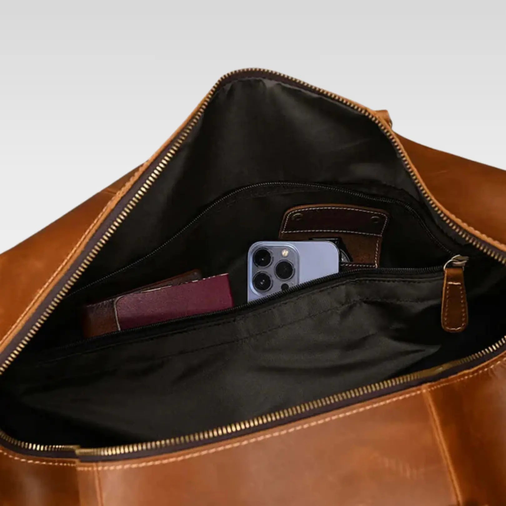 Inside profile of The Voyager genuine leather duffle bag, highlighting its durable construction and clean stitching.