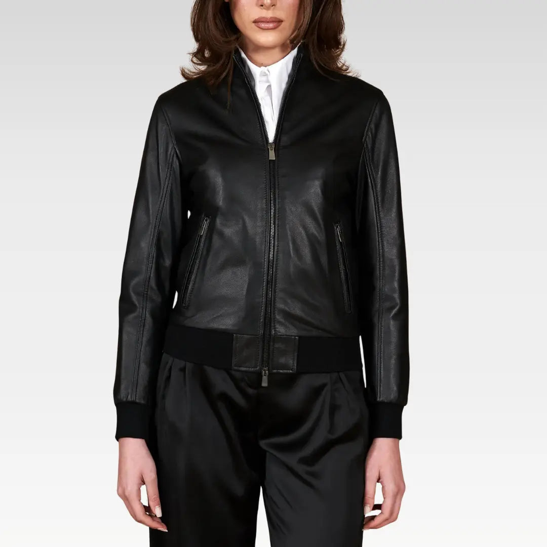 Women's cropped washed leather bomber jacket in black, full pose view with a flattering waist-length fit, perfect for versatile styling with skirts or dresses.