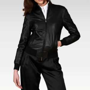 Women's cropped washed leather bomber jacket in black, close-up of the pocket detail, showcasing the modern washed texture and durable sheep leather construction.