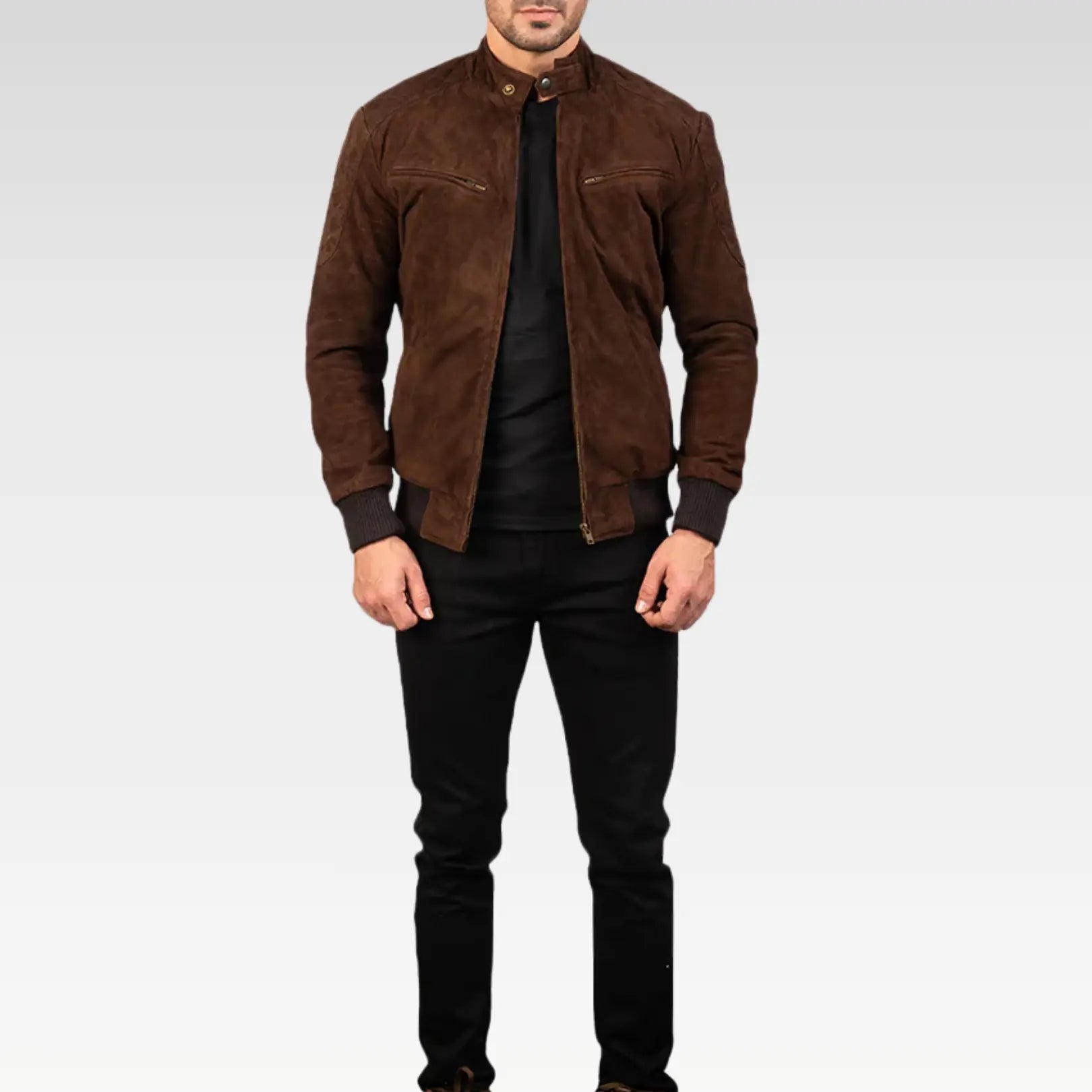 Front view of Zenith Mocha Suede Bomber Jacket in rich dark brown goatskin suede, featuring rib-knit cuffs, hem, and functional pockets, styled with black pants.