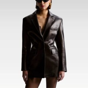 Close-up detail of black tailored leather jacket showing premium lambskin texture, notched lapel design, and two-button closure
