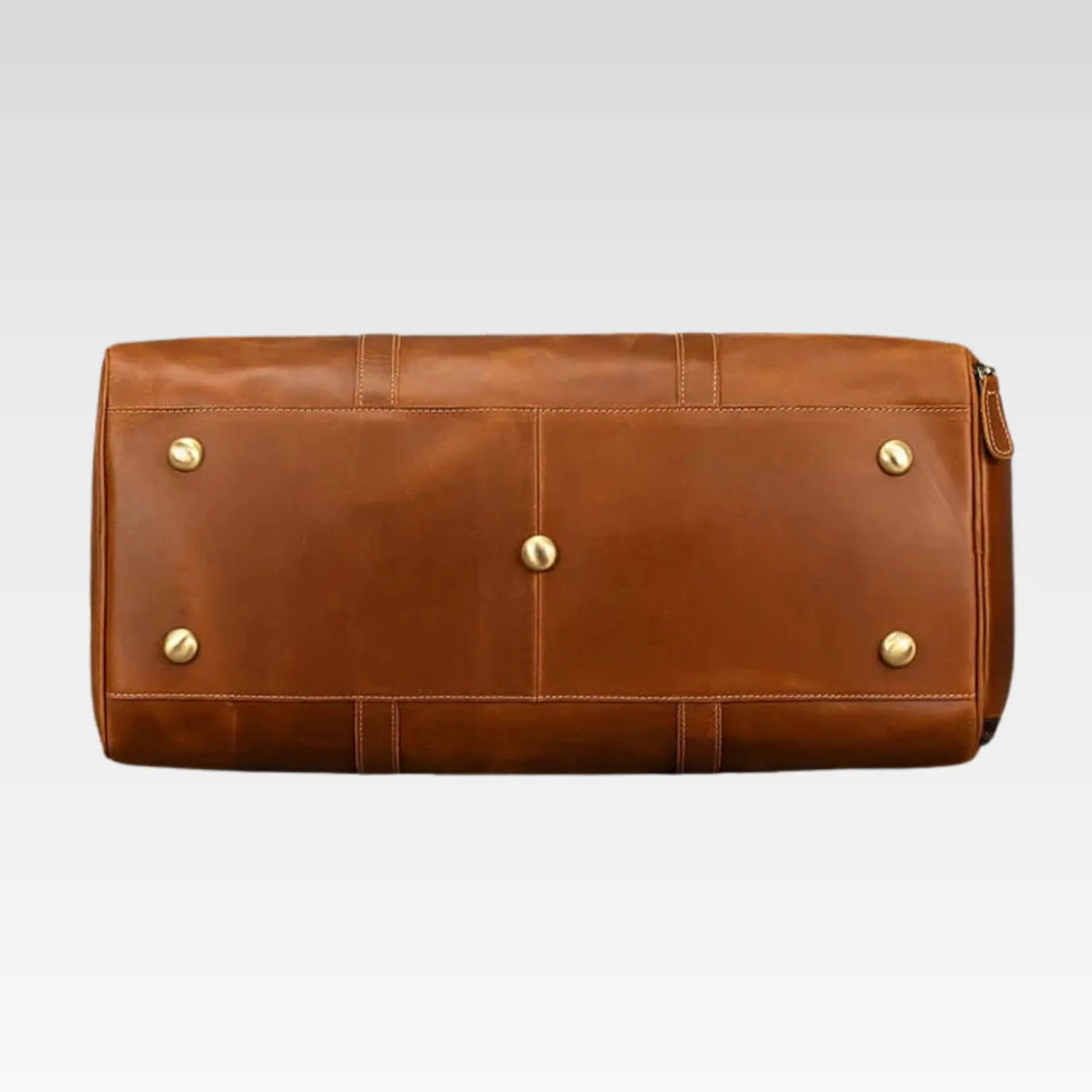 Rear view of The Voyager leather duffle bag highlighting reinforced stitching and premium leather texture.